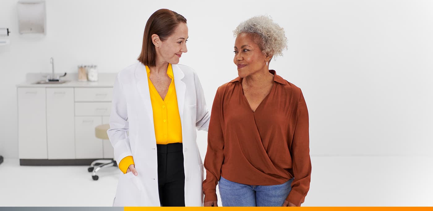 Doctor with patient in exam room